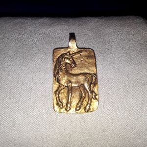 Gold tone pendant